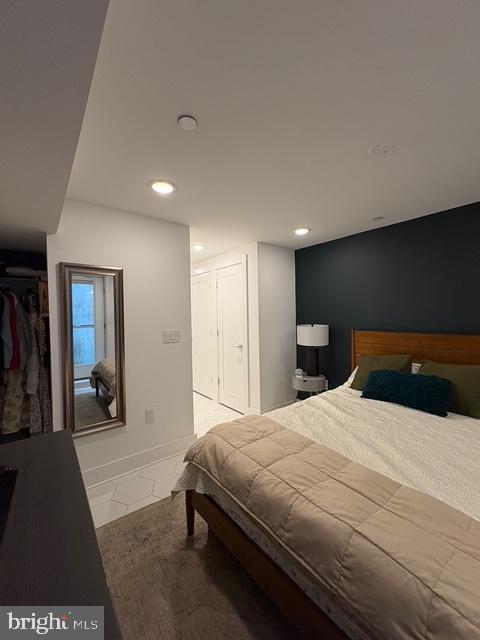 2006 Cambridge Street, Unit A Philadelphia, PA 19130 - Photo 13 of 17 a bedroom with a bed and a large mirror