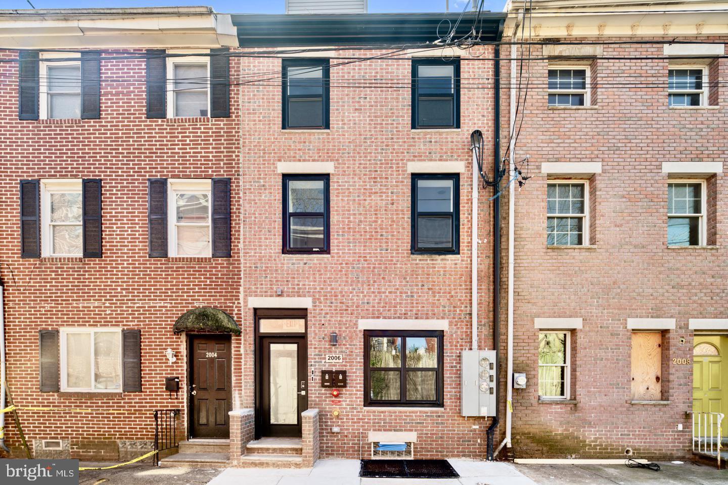 2006 Cambridge Street, Unit A Philadelphia, PA 19130 - Photo 17 of 17 a view of a building with many windows