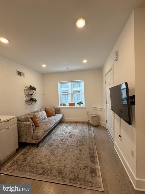 2006 Cambridge Street, Unit A Philadelphia, PA 19130 - Photo 4 of 17 a living room with furniture and a flat screen tv