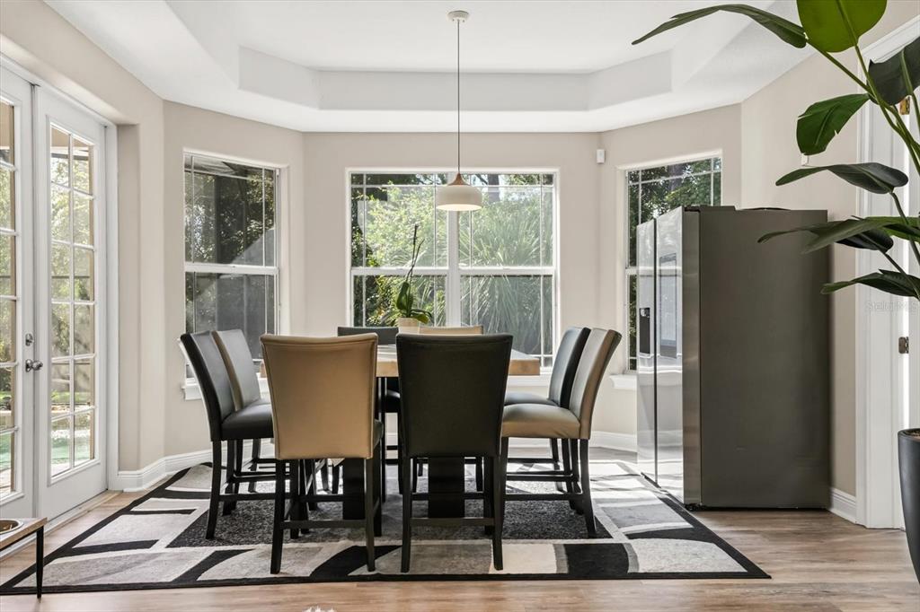 10370 Trout Road Orlando, FL 32836 - Photo 12 of 41 a view of a dining room with furniture window and wooden floor
