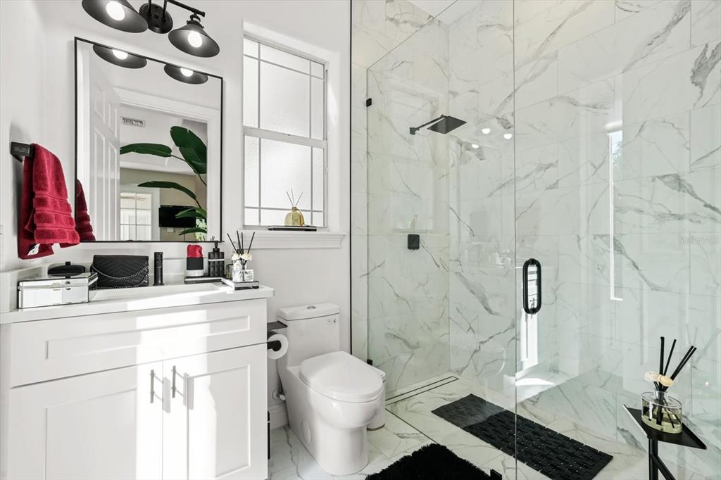 10370 Trout Road Orlando, FL 32836 - Photo 14 of 41 a bathroom with a sink a toilet and shower