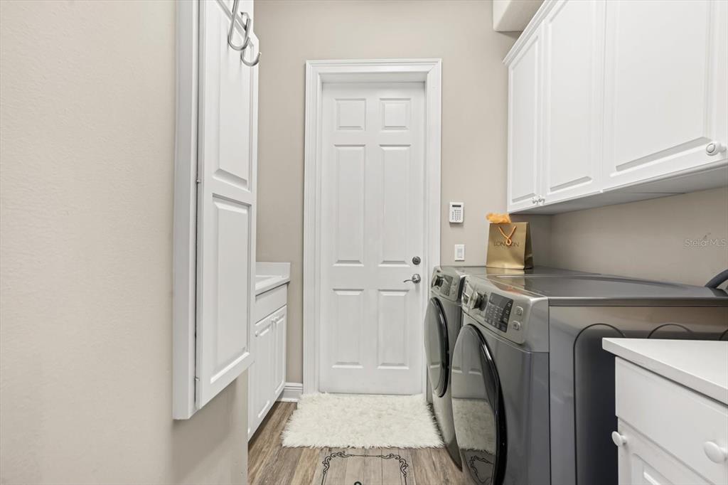 10370 Trout Road Orlando, FL 32836 - Photo 16 of 41 a utility room with dryer and washer