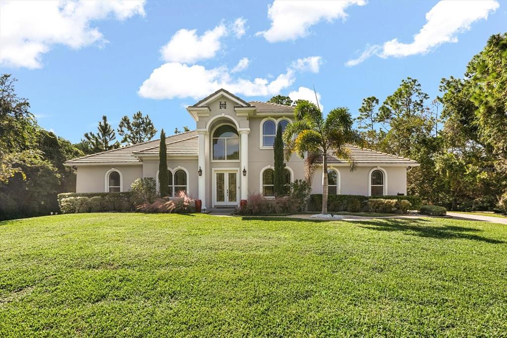 10370 Trout Road Orlando, FL 32836 - Photo 2 of 41 a view of a house with a yard