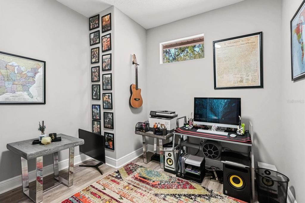 10370 Trout Road Orlando, FL 32836 - Photo 22 of 41 a room with furniture and a flat screen tv