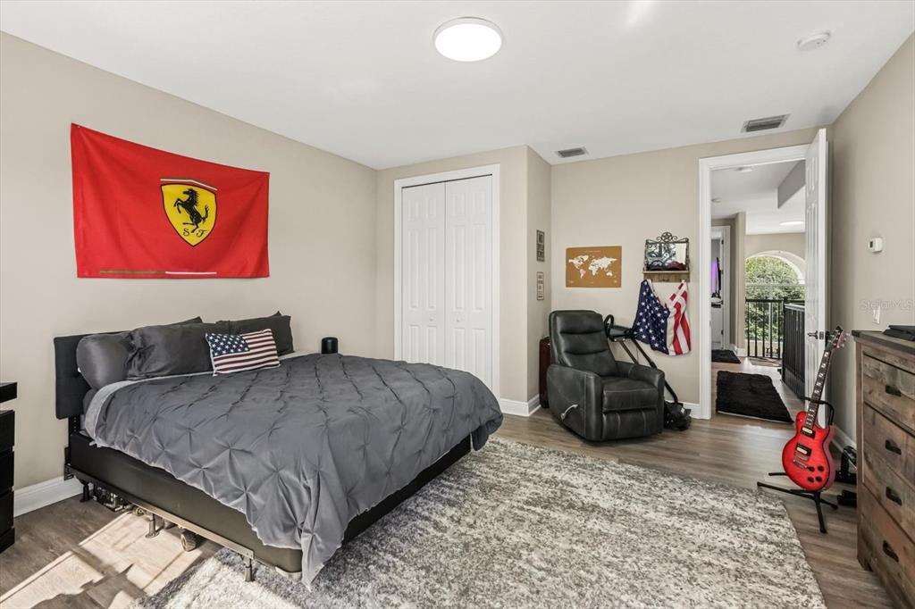 10370 Trout Road Orlando, FL 32836 - Photo 24 of 41 a bedroom with a bed and a large mirror