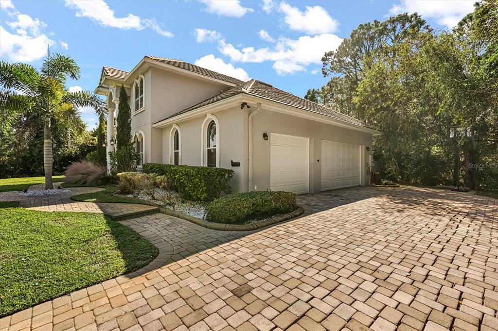 10370 Trout Road Orlando, FL 32836 - Photo 32 of 41 a view of a white house with a yard and potted plants