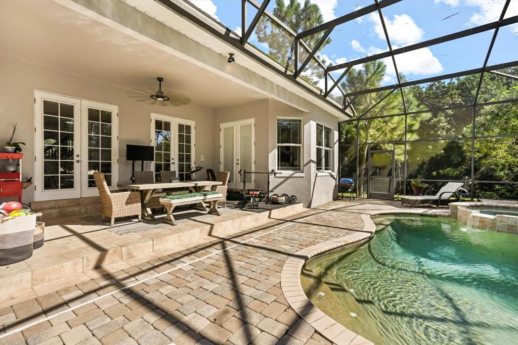 10370 Trout Road Orlando, FL 32836 - Photo 34 of 41 a view of a patio with swimming pool table and chairs