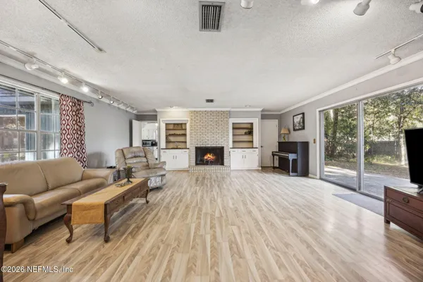 a living room with furniture and a fireplace