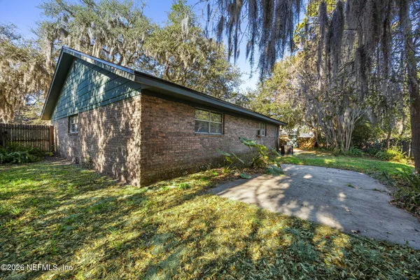a backyard of a house with lots of green space