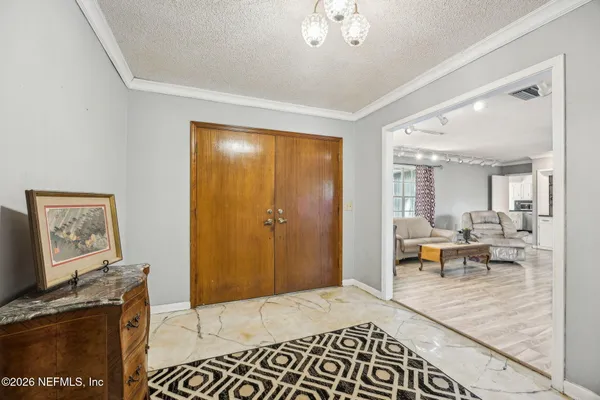a living room with furniture and a table