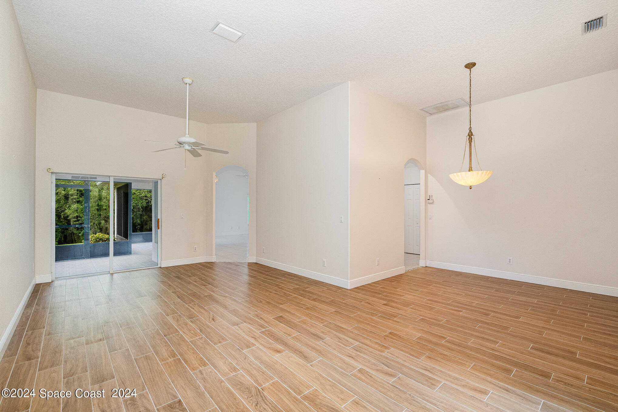 4333 Davidia Drive Melbourne, FL 32934 - Photo 16 of 44 Formal living room with sliders