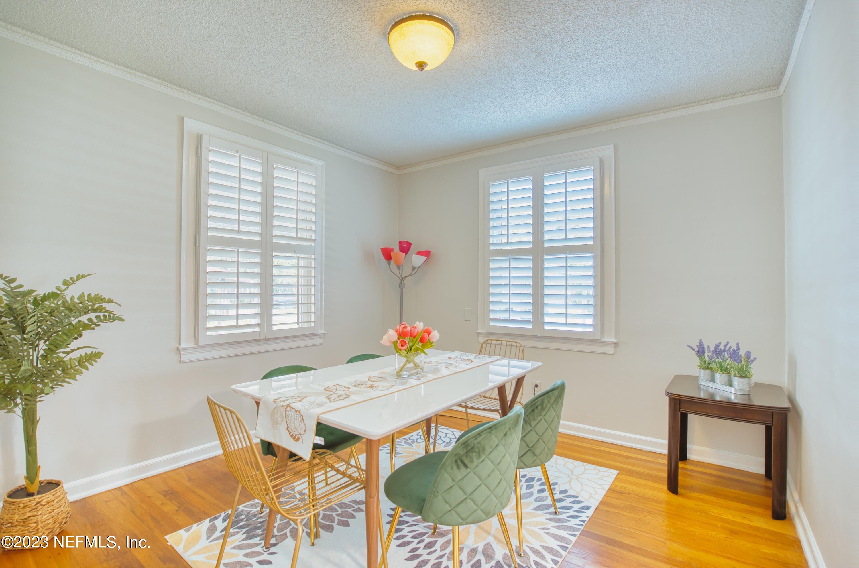 5344 Appleton Avenue Jacksonville, FL 32210 - Photo 11 of 44 a view of a dining room with furniture and wooden floor