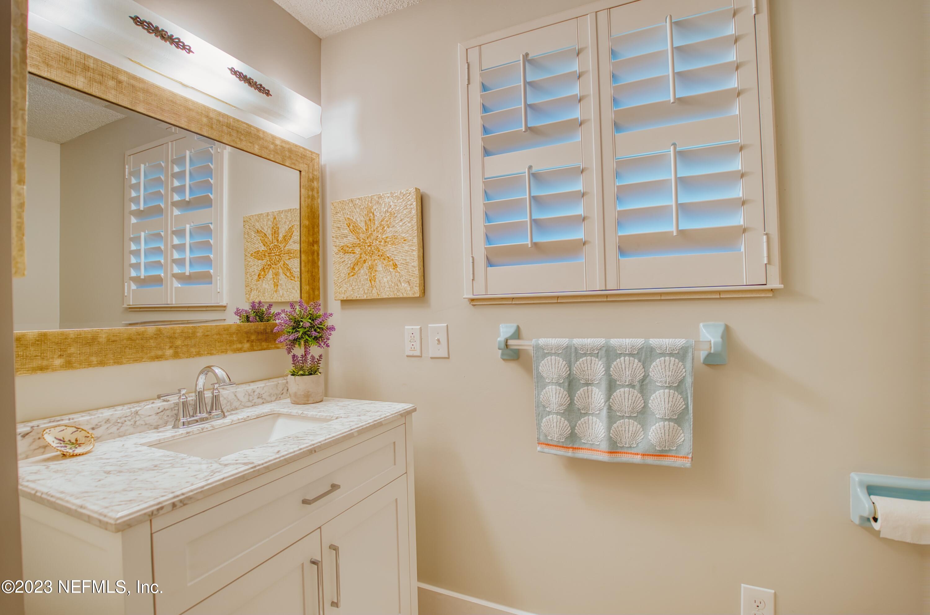 5344 Appleton Avenue Jacksonville, FL 32210 - Photo 16 of 44 a bathroom with a sink double vanity and a shower