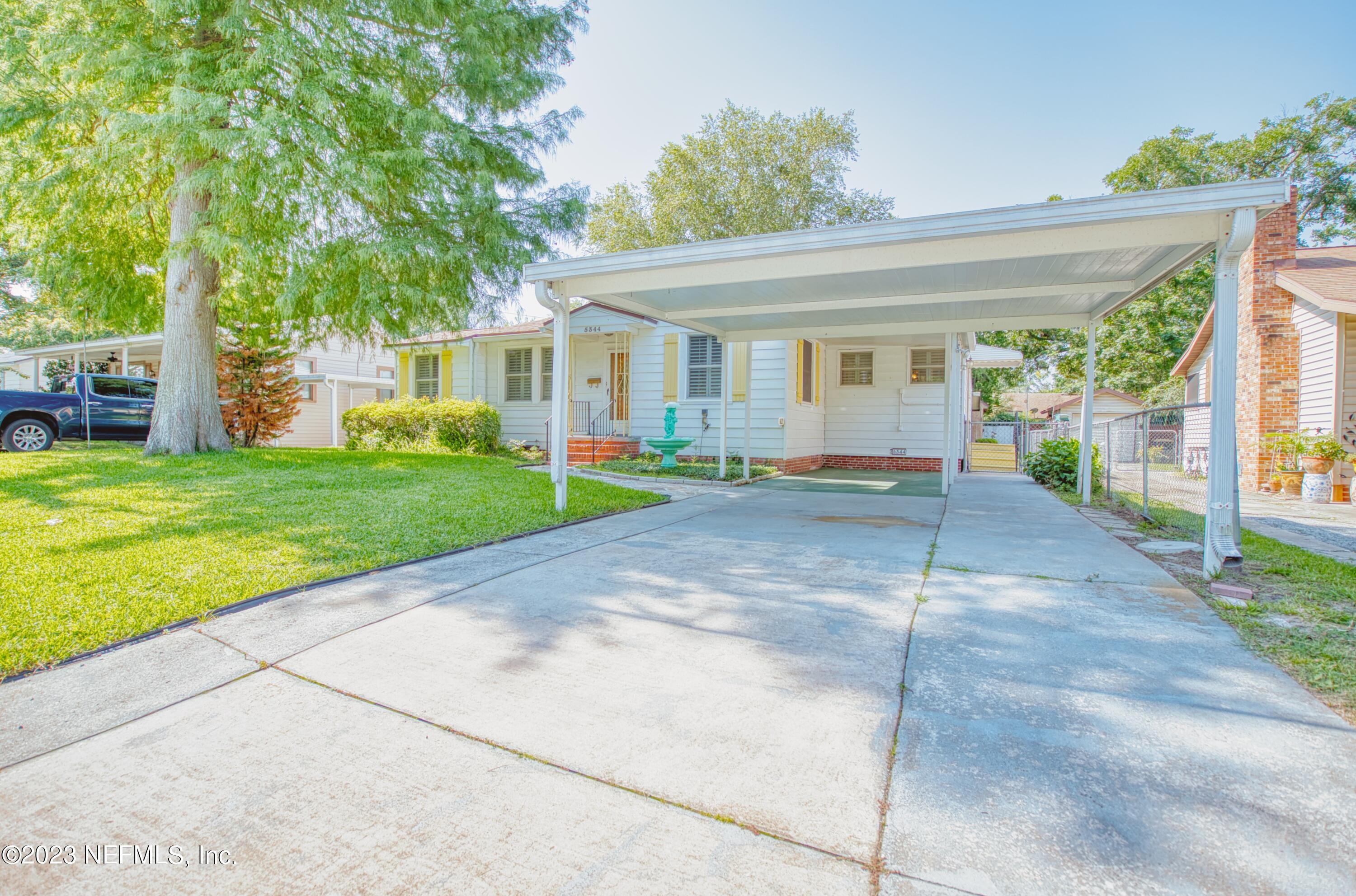5344 Appleton Avenue Jacksonville, FL 32210 - Photo 2 of 44 a view of a house with a garden