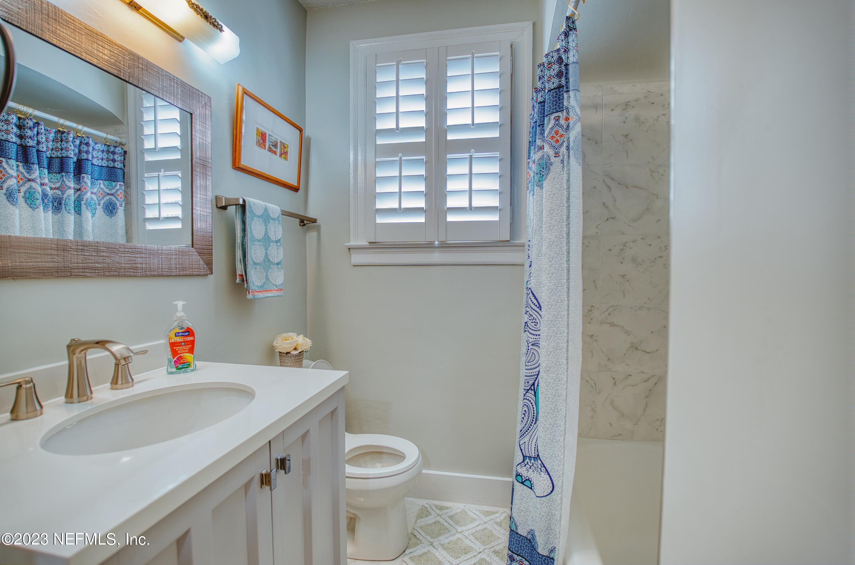 5344 Appleton Avenue Jacksonville, FL 32210 - Photo 24 of 44 a bathroom with a sink toilet and a window