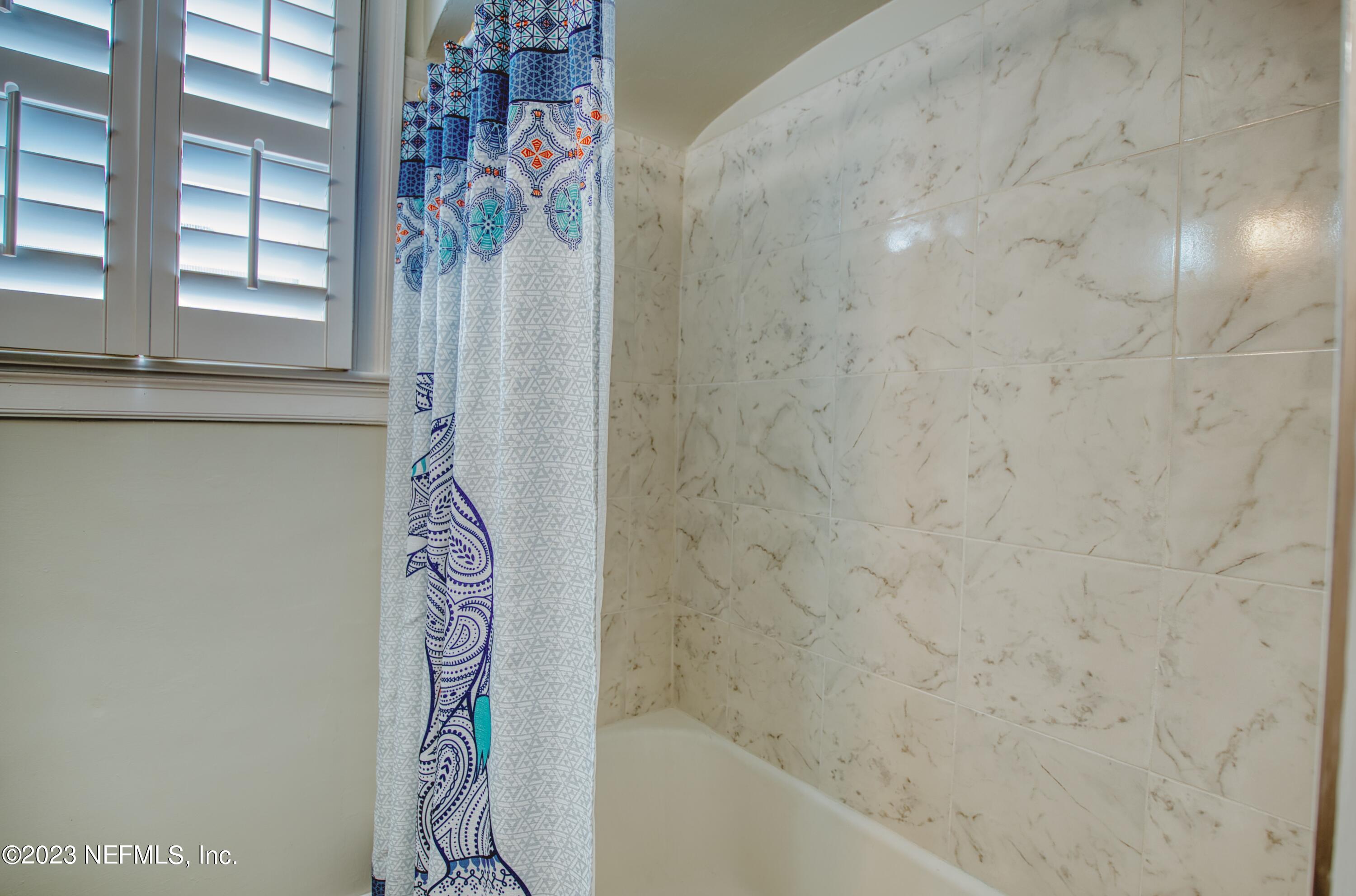 5344 Appleton Avenue Jacksonville, FL 32210 - Photo 25 of 44 a bathroom with a bathtub and shower