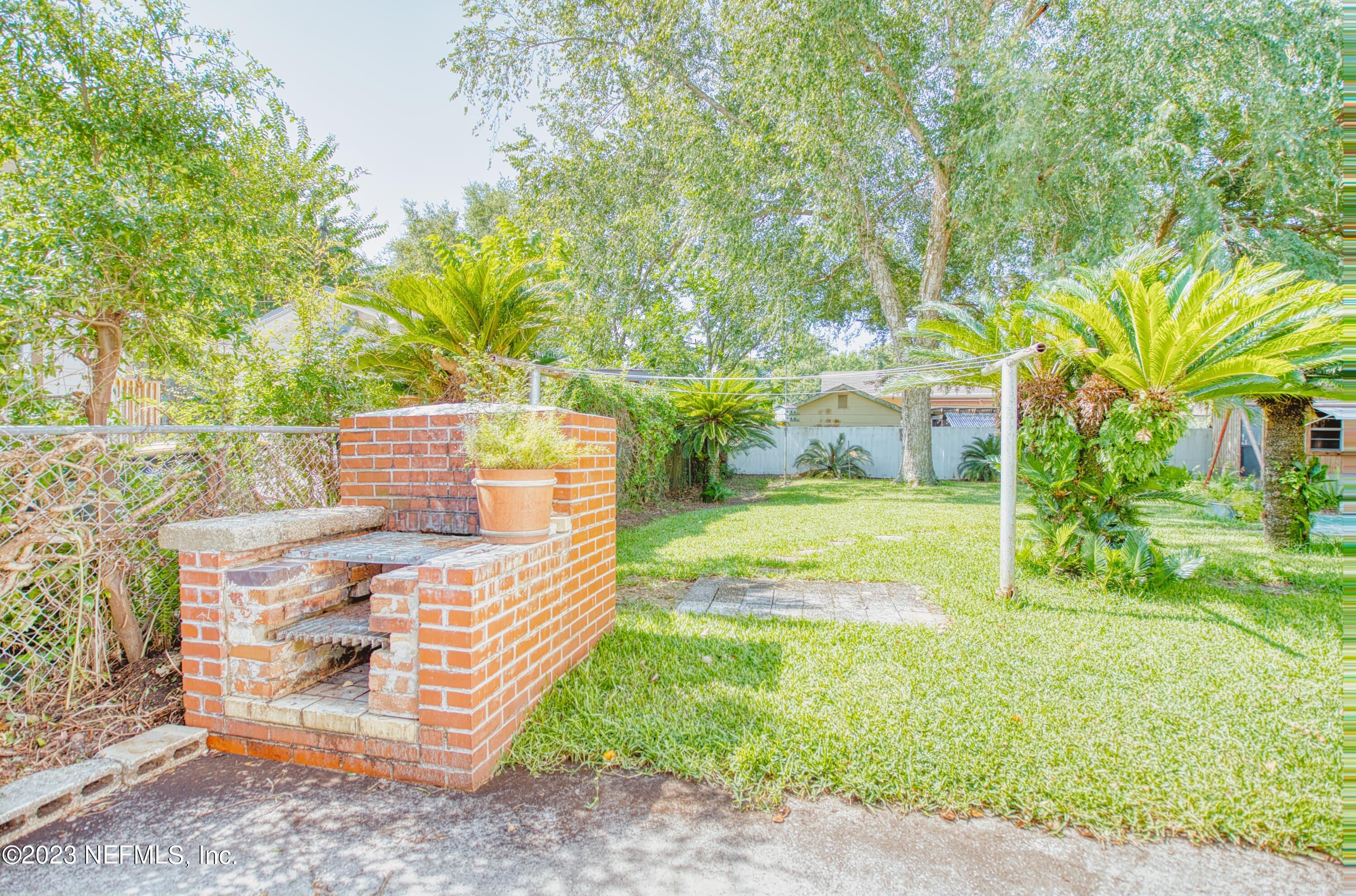 5344 Appleton Avenue Jacksonville, FL 32210 - Photo 39 of 44 a view of a yard with plants and trees