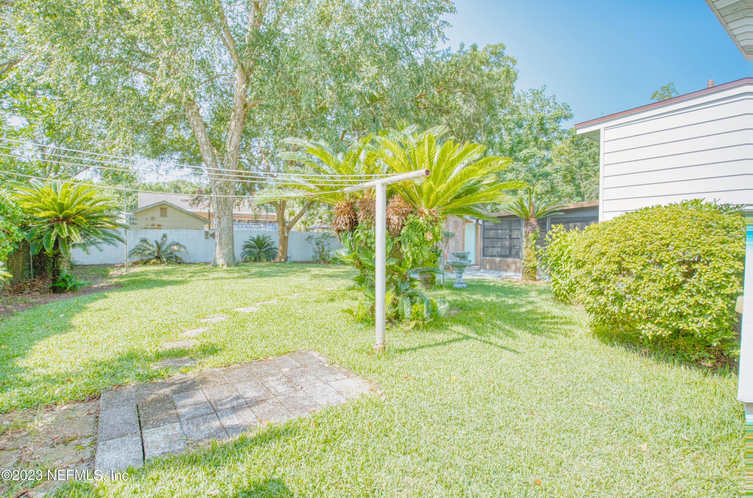 5344 Appleton Avenue Jacksonville, FL 32210 - Photo 43 of 44 a backyard of a house with table and chairs