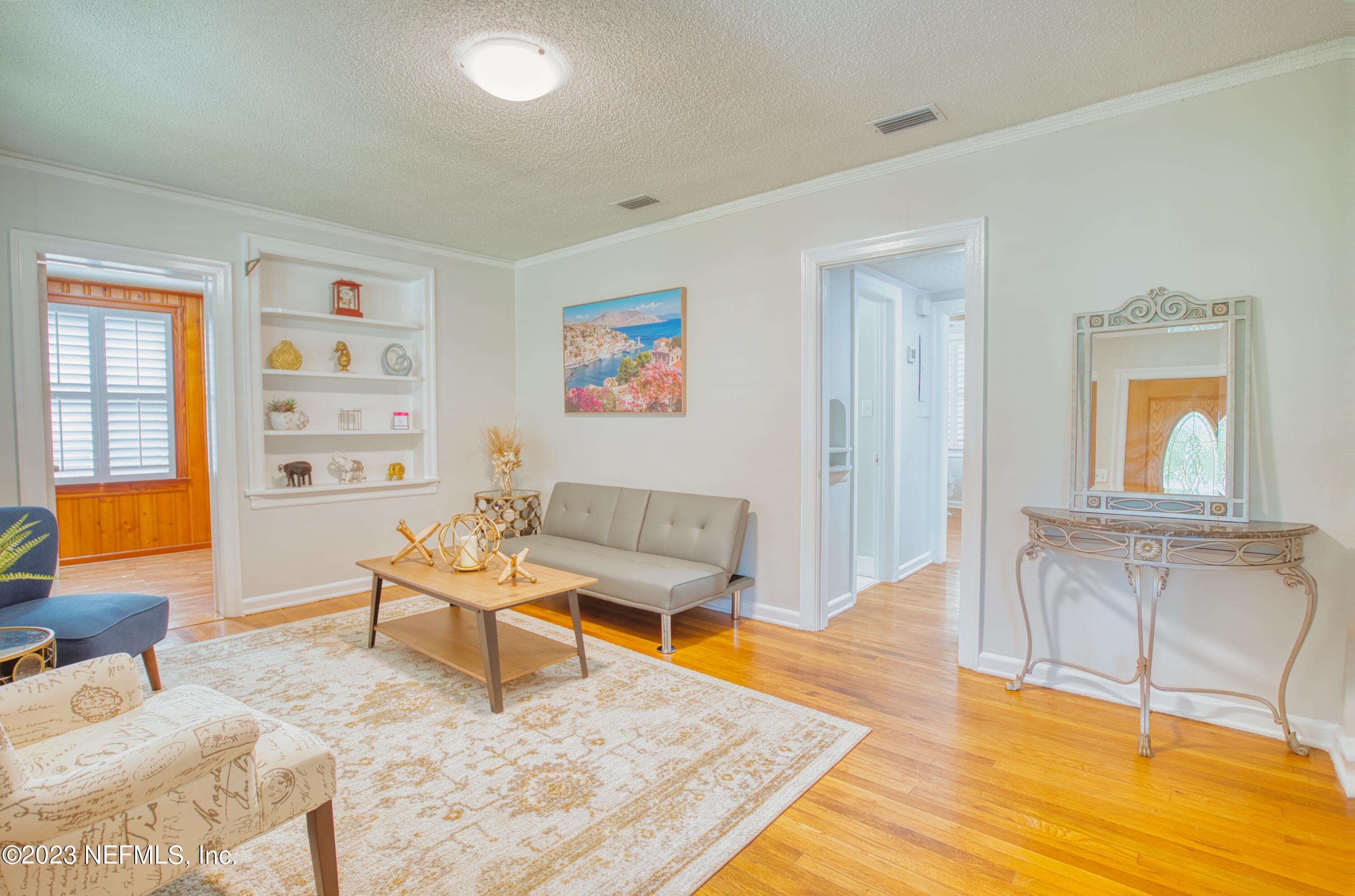 5344 Appleton Avenue Jacksonville, FL 32210 - Photo 5 of 44 a living room with furniture and wooden floor