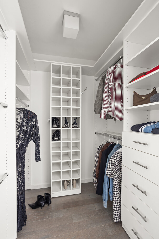 385 1st Avenue, Unit 7F Manhattan, NY 10010 - Photo 10 of 15 a view of walk in closet with clothes and shoes