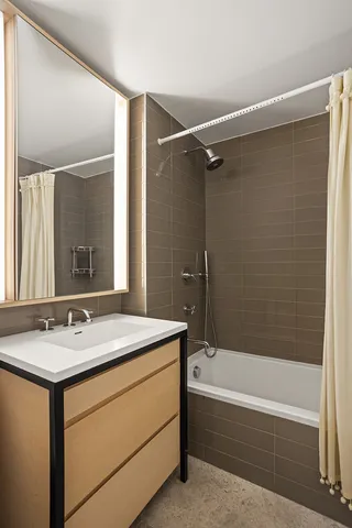 a bedroom with a large bed and a large window