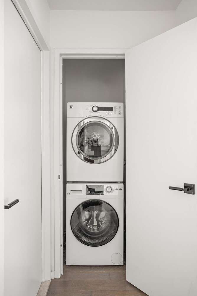 385 1st Avenue, Unit 7F Manhattan, NY 10010 - Photo 9 of 15 a utility room with dryer and washer