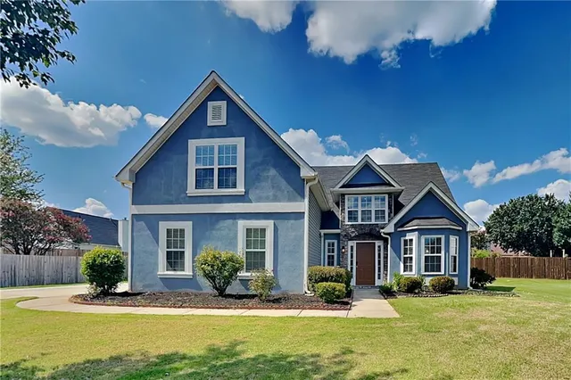 front view of a house with a yard
