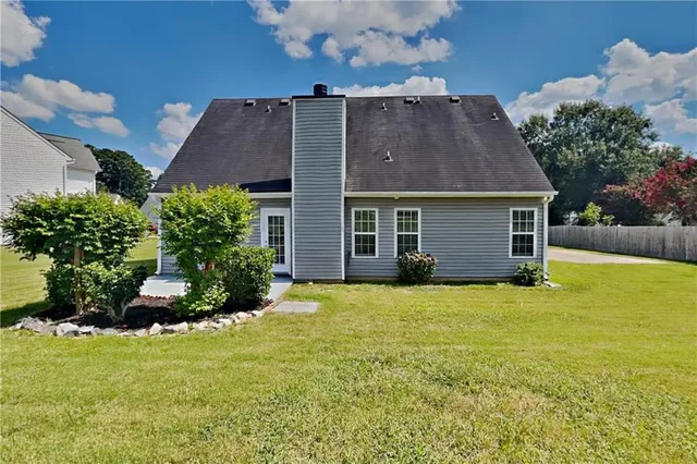 a view of a house with a garden