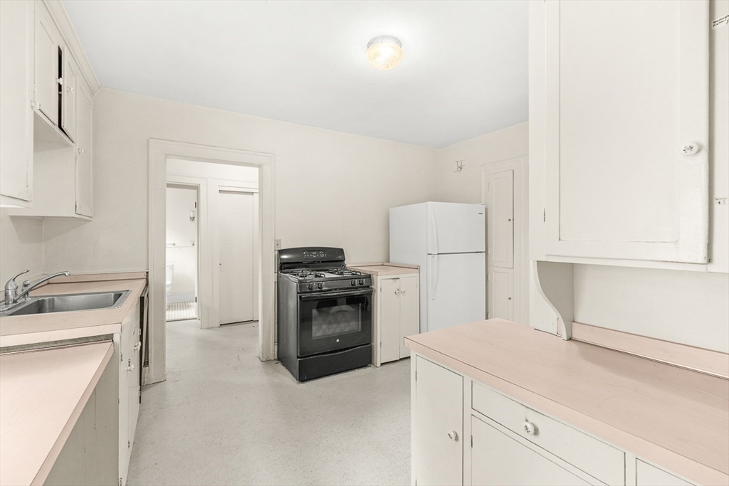30 Rangeley Road Winchester, MA 01890 - Photo 16 of 42 a kitchen with a stove top oven and refrigerator
