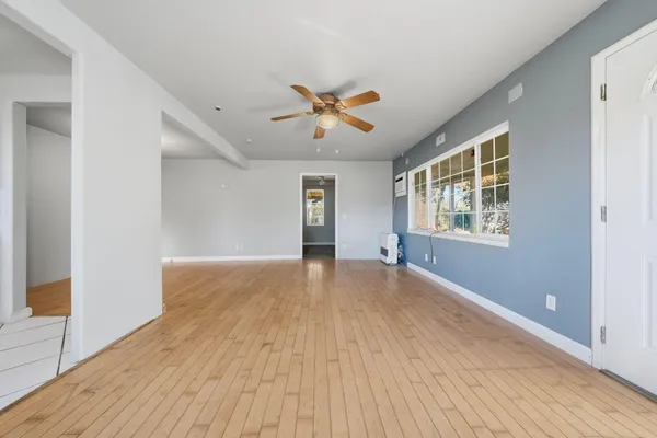 a view of an empty room with a window