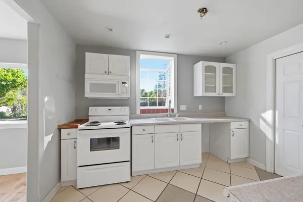 a view of a storage & utility room with a sink