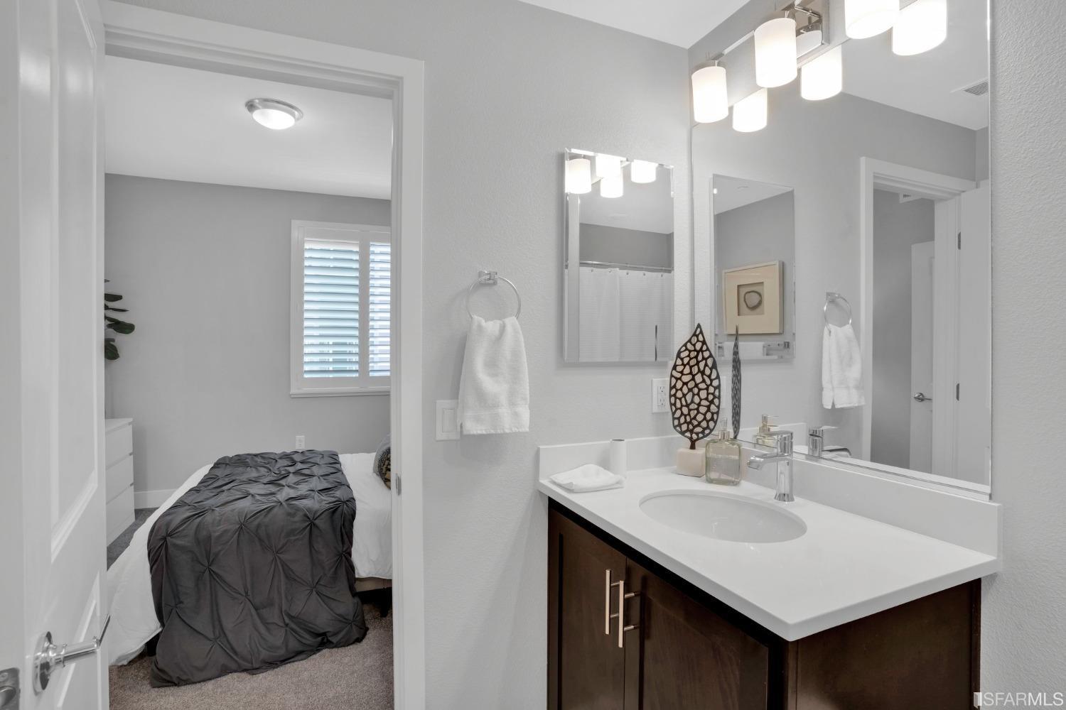 444 Trace Lane Hayward, CA 94544 - Photo 23 of 33 a en suite bathroom with a sink vanity and a mirror