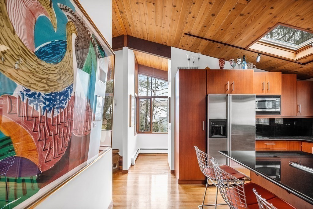 61 Scotch Pine Road Weston, MA 02493 - Photo 13 of 39 a view of a patio with table and chairs and potted plants