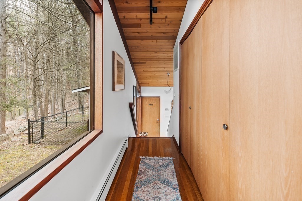 61 Scotch Pine Road Weston, MA 02493 - Photo 15 of 39 a view of a balcony with wooden floor and door