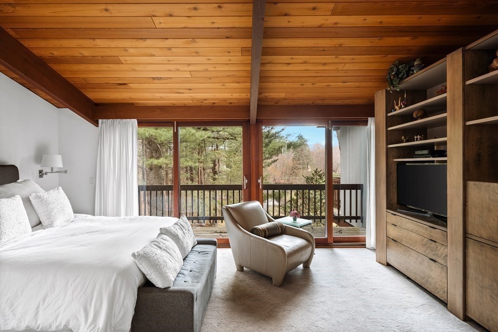 61 Scotch Pine Road Weston, MA 02493 - Photo 18 of 39 a bedroom with furniture and large window