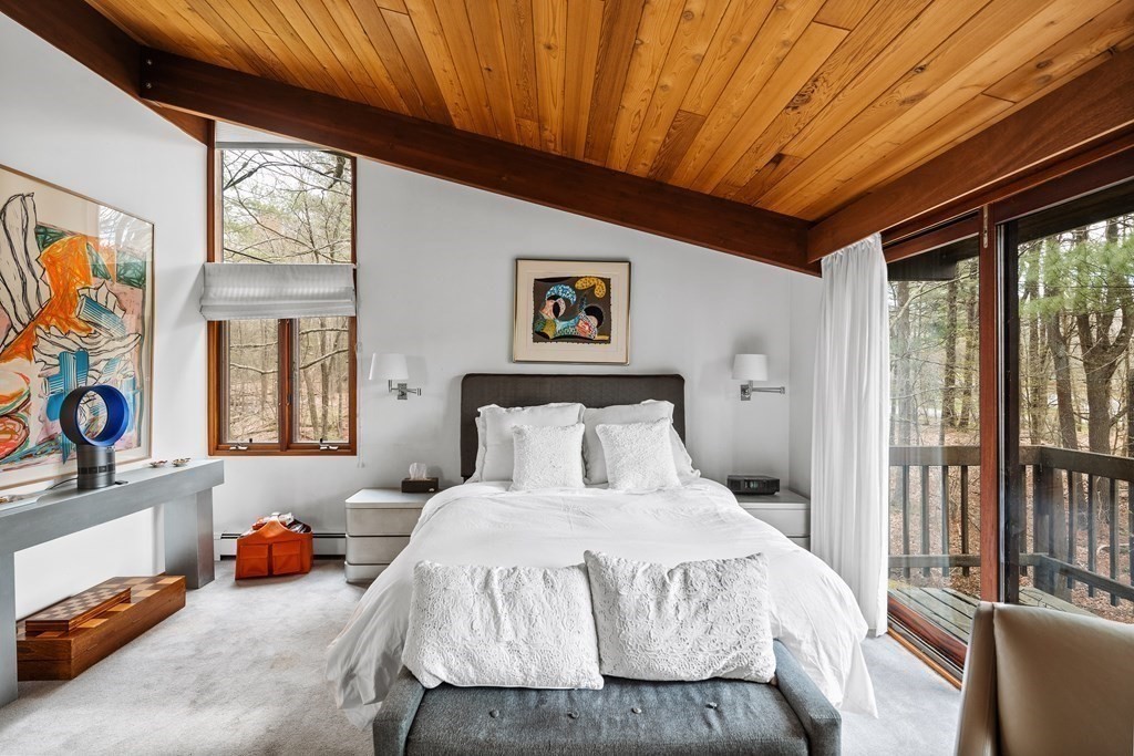 61 Scotch Pine Road Weston, MA 02493 - Photo 20 of 39 a bedroom with furniture and a large window