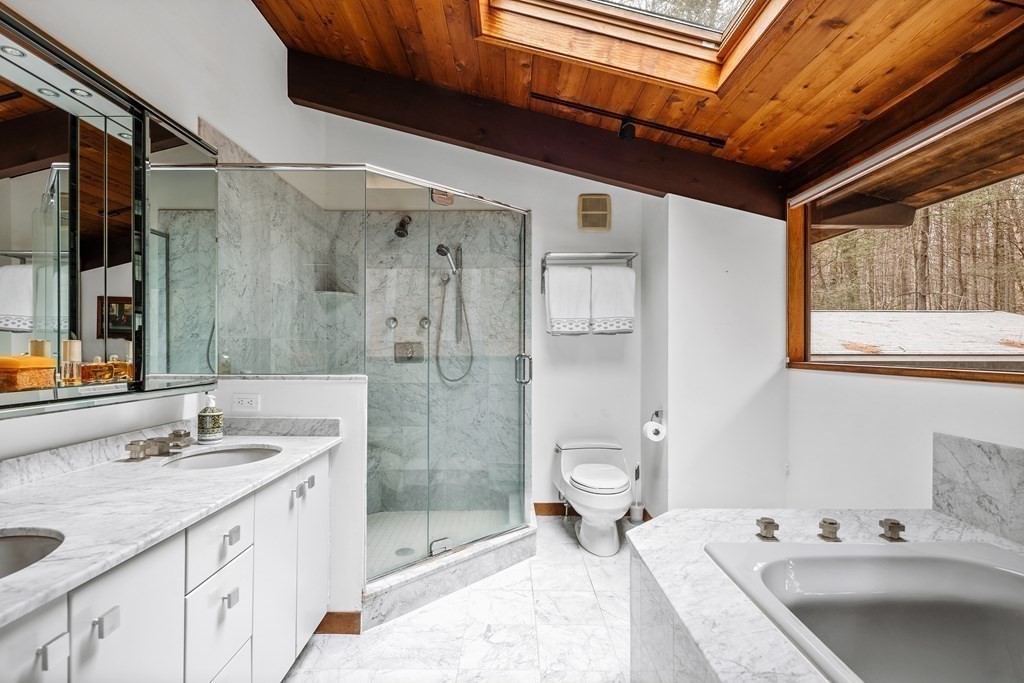 61 Scotch Pine Road Weston, MA 02493 - Photo 23 of 39 a bathroom with a double vanity sink toilet and shower
