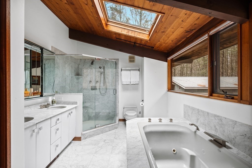 61 Scotch Pine Road Weston, MA 02493 - Photo 24 of 39 a spacious bathroom with a tub sink shower and mirror