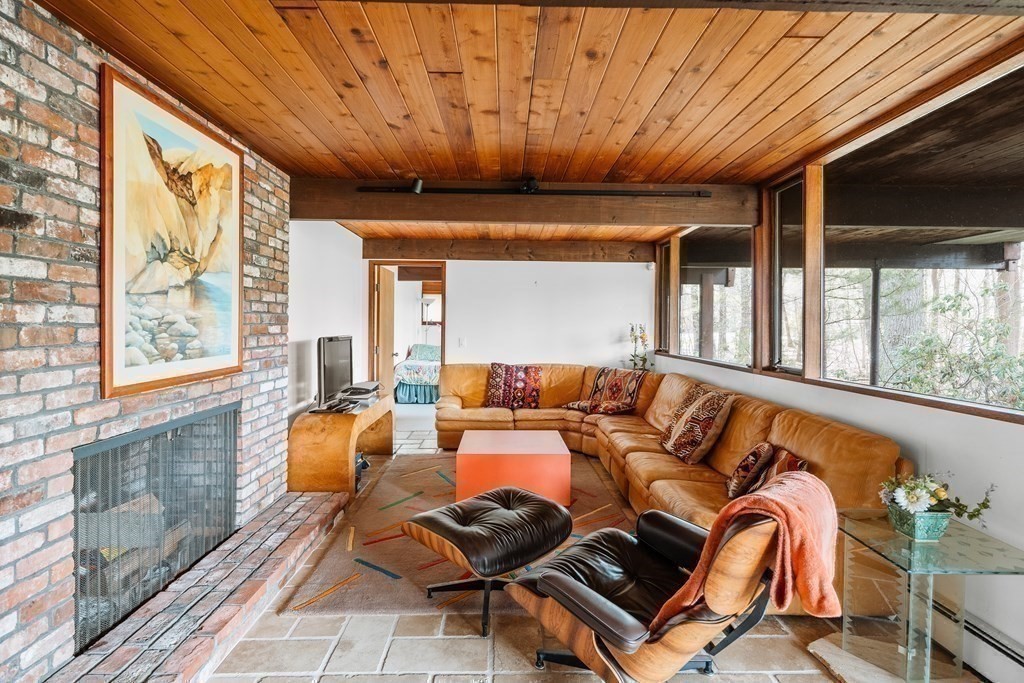 61 Scotch Pine Road Weston, MA 02493 - Photo 26 of 39 a living room with furniture a large window with outer view