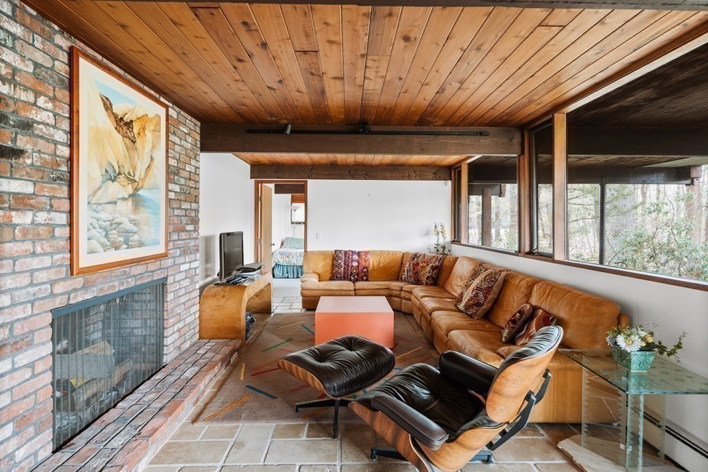 61 Scotch Pine Road Weston, MA 02493 - Photo 27 of 39 a living room with furniture and a large window