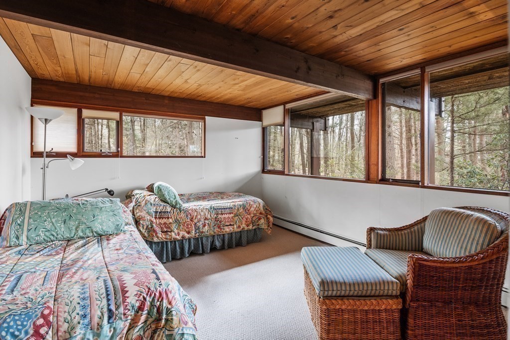 61 Scotch Pine Road Weston, MA 02493 - Photo 28 of 39 a bedroom with furniture and a window