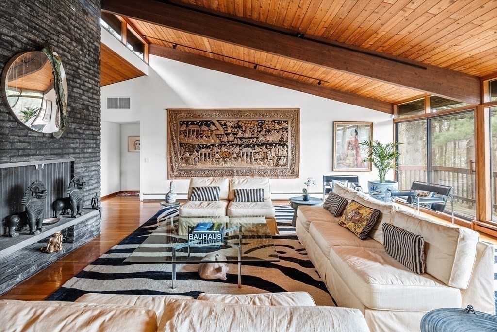 61 Scotch Pine Road Weston, MA 02493 - Photo 3 of 39 a living room with furniture fireplace and a large window
