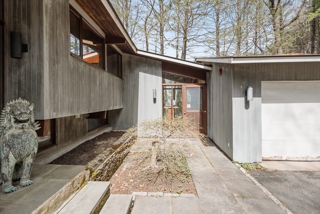 61 Scotch Pine Road Weston, MA 02493 - Photo 32 of 39 a front view of a house with pathway