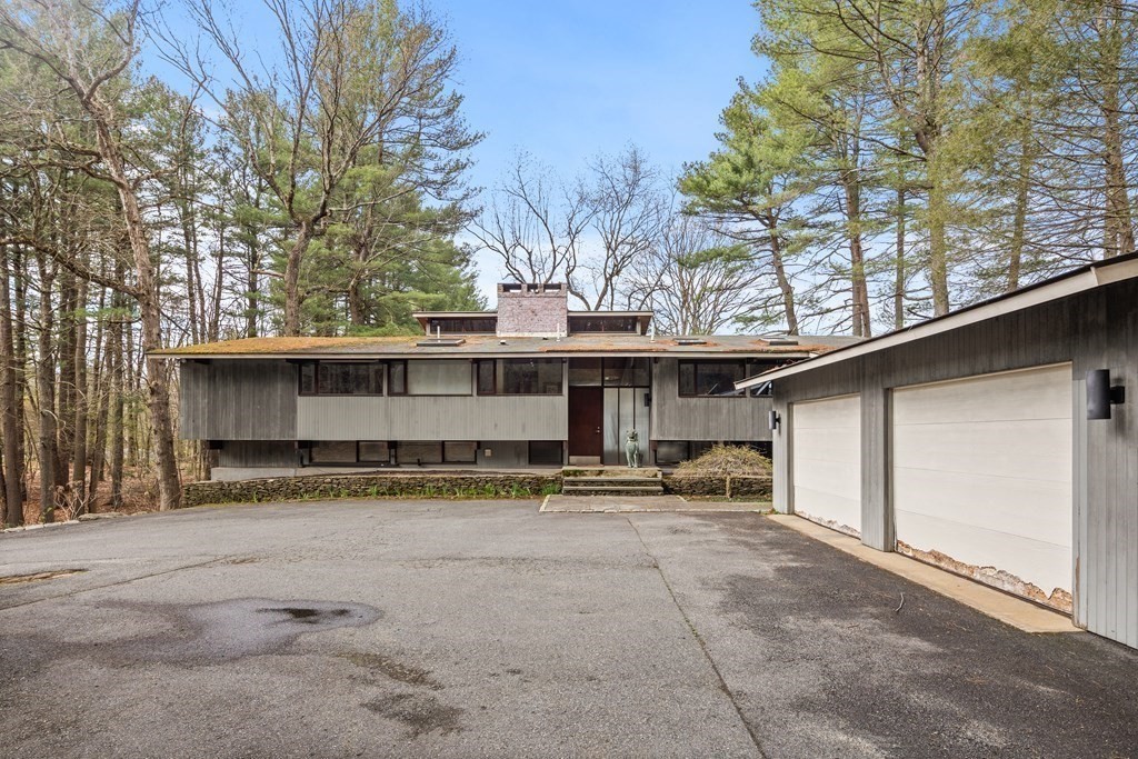 61 Scotch Pine Road Weston, MA 02493 - Photo 35 of 39 a view of a house with a large parking space and a tree