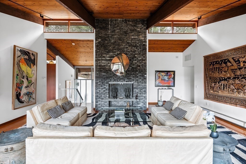61 Scotch Pine Road Weston, MA 02493 - Photo 4 of 39 a living room with furniture and a fireplace