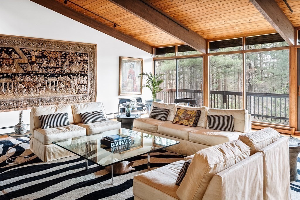 61 Scotch Pine Road Weston, MA 02493 - Photo 6 of 39 a living room with furniture large windows and wooden floor