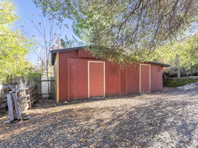 8987 Soda Bay Road Kelseyville, CA 95451 - Photo 53 of 61 a view of backyard with large tree and wooden fence
