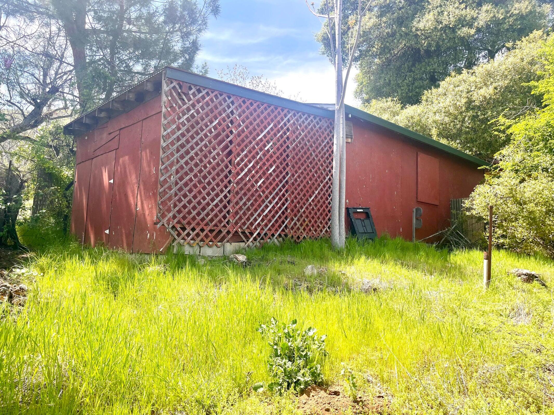 8987 Soda Bay Road Kelseyville, CA 95451 - Photo 54 of 61 a backyard of a house with swimming pool and wooden bench