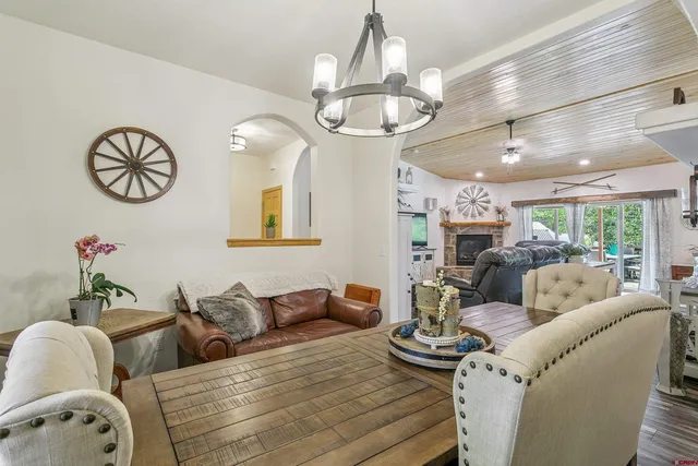 a living room with furniture chandelier and a chandelier