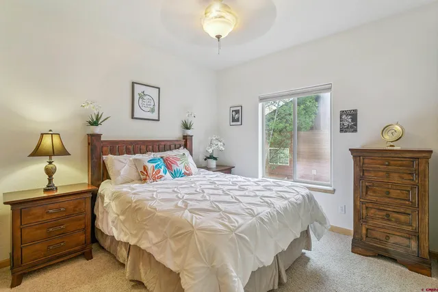 a bedroom with a bed and a cabinets